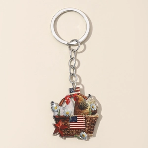 Detail of acrylic chicken keychain with American flag motif and silver metal ring