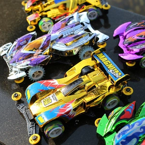 Macro shot of colorful mini 4WD toy cars with metallic finish and reflections