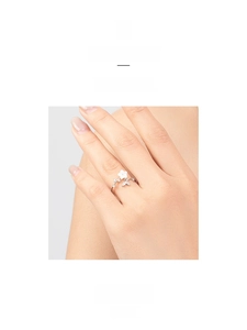 Detail of s925 sterling silver open ring with white flower and sparkling crystals
