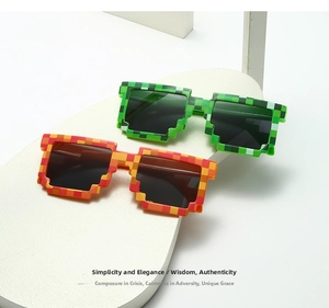 Close-up of pixelated mosaic style sunglasses in green and red colors for party props