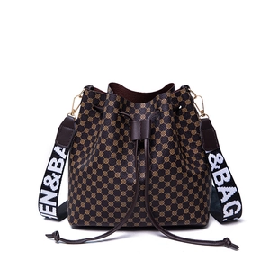 Brown bucket bag with circular pattern and wide logo shoulder strap in high-quality PU