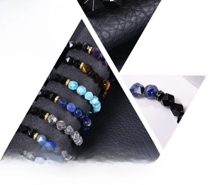 Detailed view of 10mm faceted blue agate and obsidian natural stone beaded bracelets