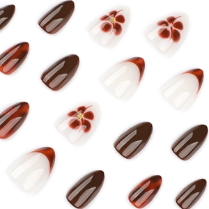 Short almond press-on nails featuring brown amber patterns and red French floral designs