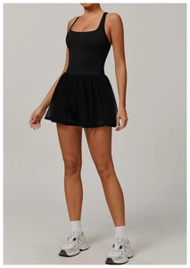 Detail of black sports dress with breathable mesh skirt and two-piece layered design