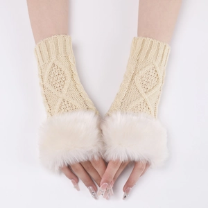 Detailed knit texture of beige arm warmers with plush white faux fur trim cuffs