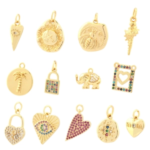 Collection of 13 gold-plated zircon pendants with heart, eye and animal designs