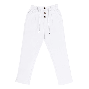Detail of white linen pants featuring a drawstring waist and dark tortoiseshell buttons