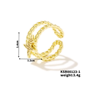 Detail of gold-plated star ring with twisted chain design and cubic zirconia inlay
