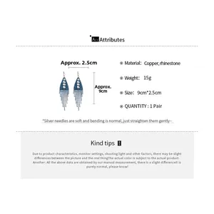 Detail view of blue beaded tassel earrings with dimensions 9cm by 2.5cm on white background