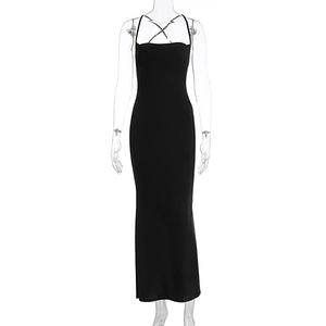 Detail of elegant black bodycon dress with criss-cross halter straps and fishtail hem