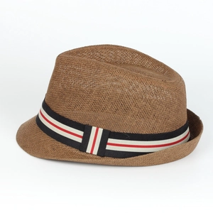 Close-up of a brown woven straw fedora hat featuring a striped decorative ribbon