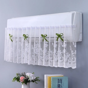 Detailed white lace air conditioner cover featuring delicate floral mesh and green bows