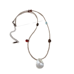 Colorful beaded necklace with white mother-of-pearl teardrop pendant for vacation style