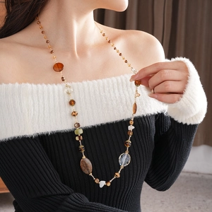 Detail of irregular white marble and agate beads on vintage Maillard style long necklace