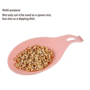 Pink silicone spoon rest and multi-purpose dipping dish with a hanging hole design