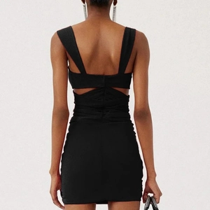 Sexy black backless mini dress with ruched details and cutout design for evening wear