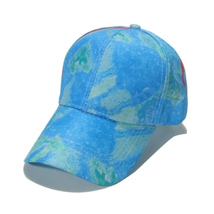 Detail view of colorful marble tie-dye baseball cap with reinforced stitched curved brim