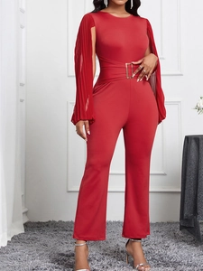 Elegant red slim-fit jumpsuit featuring pleated cape sleeves and a metal buckle waist belt