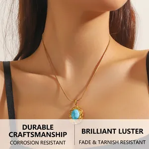 Detail of vintage gold-plated snake chain necklace with an oval turquoise pendant