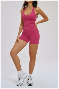Close-up of rose red V-neck yoga set including sports tank top and high-waist shorts