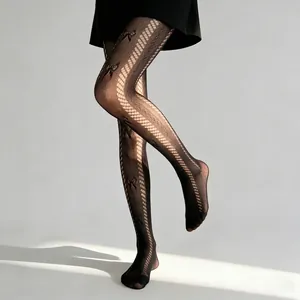 Elegante schwarze Lolita-Spitzenstrumpfhose mit Jacquard-Schleife und vertikaler Netzoptik