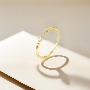 Macro shot of S925 silver gold-plated open ring with pear-cut zircon and S925 hallmark