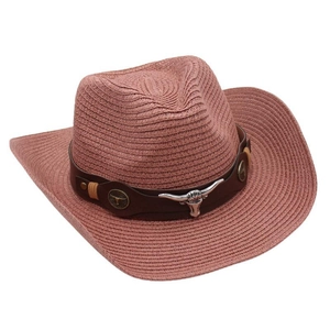 Detailed close-up view of pink straw cowboy hat with metallic bullhead ornament accessory