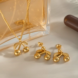 Elegant 18K gold cherry jewelry set including necklace and earrings for women