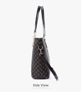 Side view of large brown monogram tote bag showing slim handles and gold-tone hardware detail