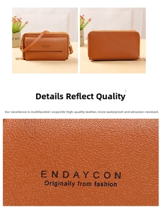 Close-up of litchi-pattern faux leather and multi-zipper compartments on brown crossbody bag