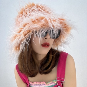 Close-up of soft pink faux fur bucket hat texture and fluffy warm material