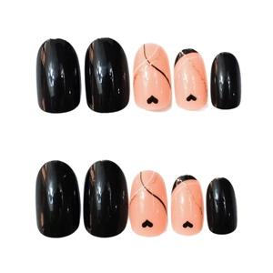 Press-on nails set with black hearts and gold glitter lines in pink and black glossy finish