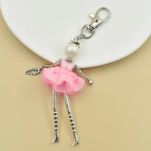 Pink tulle ballerina keychain with large white pearl head and silver alloy leg charms