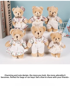 Close-up of six small linen teddy bears in country-style outfits with metal keychains
