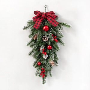 Christmas Teardrop Swag with Flocked Pine Needles Red Bow and Ornaments on White Background