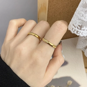 Minimalist 18K gold plated stackable star moon rings with small diamond on model hand