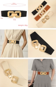Detail of high-elastic wide belt featuring a large gold interlocking circular metal buckle