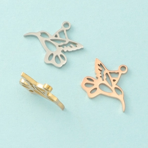 Polished hollow hummingbird charms in silver, gold, and rose gold stainless steel finishes