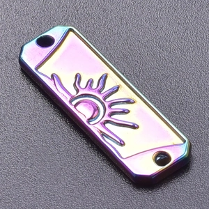 Macro view of rainbow plating stainless steel sun and moon pendant with small holes