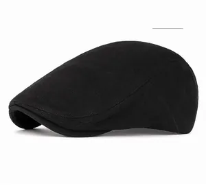 Detail view of premium black corduroy newsboy cap showing fine knitting texture and curved brim