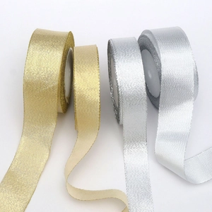 Detail of gold and silver glitter ribbons in different widths for Christmas decoration