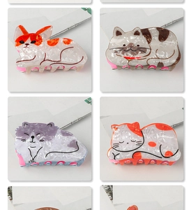 Macro display of diverse cartoon cat hair claws in colorful acetate marble finishes