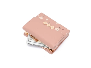 Detailed interior of pink floral trifold wallet showing cash slots and card holders