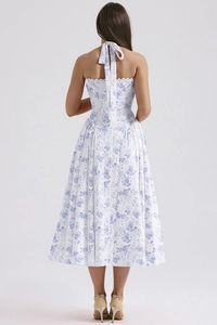 Detail of cross-back tie design on floral halter dress with blue and white summer prints