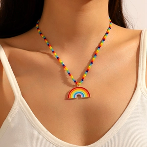 Rainbow bead necklace with heart magnetic pendant and golden rainbow charm on model