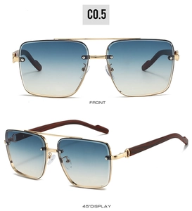 Detail view of large metal frame sunglasses with gradient lenses and wood grain temples