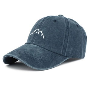 Detail of mountain embroidery and washed vintage texture on charcoal baseball cap