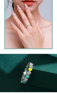 Detail of colorful enamel and sparkling zircon hearts on an S925 sterling silver ring