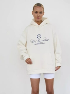 Detail of cream oversized hoodie featuring blue letter print and front kangaroo pocket