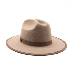 Close-up of khaki wool fedora hat featuring a dark brown grosgrain ribbon and piped edge